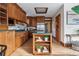 Open concept kitchen with island, ample cabinetry, and hardwood floors at 1149 Steele St, Denver, CO 80206