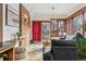 Bright living room featuring exposed brick wall and access to a patio at 1149 Steele St, Denver, CO 80206