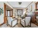 Living room with hardwood floors, fireplace, and two armchairs at 1149 Steele St, Denver, CO 80206