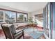 Bright home office with large windows and built-in shelving at 1149 Steele St, Denver, CO 80206