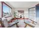 Bright home office with large windows and built-in shelving at 1149 Steele St, Denver, CO 80206