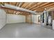Unfinished basement featuring exposed beams, concrete flooring, and utilities, ready for customization and expansion at 5380 S Prescott St, Littleton, CO 80120
