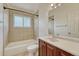 Bathroom features tile surround, shower, and vanity at 5380 S Prescott St, Littleton, CO 80120