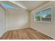 Bedroom with new flooring, vaulted ceilings, and window at 5380 S Prescott St, Littleton, CO 80120