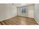 Bedroom with new flooring and a window at 5380 S Prescott St, Littleton, CO 80120