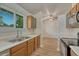 An eat-in kitchen with stainless steel sink and range and a window at 5380 S Prescott St, Littleton, CO 80120