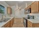 An eat-in kitchen with stainless steel sink and range at 5380 S Prescott St, Littleton, CO 80120