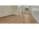 Inviting living area with wood-look floors and a window providing natural light at 5380 S Prescott St, Littleton, CO 80120