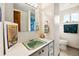 Bathroom with an avocado colored sink, linoleum countertops and flooring, and nautical themed decor at 1069 Crestmoor Dr, Boulder, CO 80303