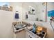 Cozy bathroom with tile accents, decorative lighting, and a unique vanity at 1069 Crestmoor Dr, Boulder, CO 80303