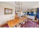 A dining room with a long table is open to the living room at 1069 Crestmoor Dr, Boulder, CO 80303