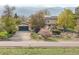 Inviting home with mature trees, landscaping, a two car garage and mountain views at 1069 Crestmoor Dr, Boulder, CO 80303