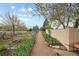 Charming garden featuring lush greenery, raised beds, and gravel pathways at 1069 Crestmoor Dr, Boulder, CO 80303