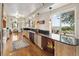 Bright kitchen featuring hardwood floors, ample counter space, and a scenic view at 1069 Crestmoor Dr, Boulder, CO 80303