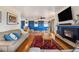 Spacious living room with hardwood floors, a fireplace and open layout at 1069 Crestmoor Dr, Boulder, CO 80303