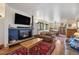 Living room with a fireplace, hardwood floors and an open dining room at 1069 Crestmoor Dr, Boulder, CO 80303