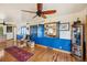 Living room has hardwood floors, ceiling fan, and views to the kitchen at 1069 Crestmoor Dr, Boulder, CO 80303