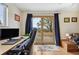 Bright office space with a desk, natural light, and a door to the outdoor patio at 1069 Crestmoor Dr, Boulder, CO 80303