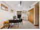 Bright office space featuring carpet, a desk, a closet, and multiple windows at 1069 Crestmoor Dr, Boulder, CO 80303