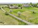 Picturesque aerial view showcasing a spacious lot with mature trees and a private driveway at 8236 S Ireland Way, Aurora, CO 80016