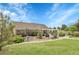 Secluded backyard patio with pergola amid lush landscaping, a serene retreat for outdoor relaxation and entertainment at 8236 S Ireland Way, Aurora, CO 80016