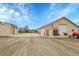 Large backyard with basketball court and outbuildings which are perfect for extra storage at 8236 S Ireland Way, Aurora, CO 80016