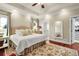 Bright bedroom with a tray ceiling, ensuite, and a walk-in closet at 8236 S Ireland Way, Aurora, CO 80016