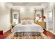 Beautiful bedroom with hardwood floors, neutral walls, and plenty of natural light at 8236 S Ireland Way, Aurora, CO 80016