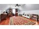 Versatile bonus room featuring hardwood floors and a cozy atmosphere at 8236 S Ireland Way, Aurora, CO 80016