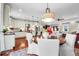 Open-concept kitchen and dining area featuring modern appliances and ample counter space at 8236 S Ireland Way, Aurora, CO 80016