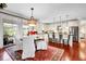 Bright kitchen and dining area with modern appliances and hardwood floors at 8236 S Ireland Way, Aurora, CO 80016