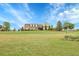 Charming single-Gathering home on a sprawling lawn with brick and siding accents under a beautiful blue sky at 8236 S Ireland Way, Aurora, CO 80016
