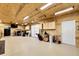 Spacious garage featuring built-in cabinets, ample storage, and a convenient garage door at 8236 S Ireland Way, Aurora, CO 80016