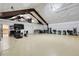 Expansive garage featuring a fitness area and workshop; ideal for hobbies or extra storage at 8236 S Ireland Way, Aurora, CO 80016