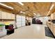 Organized garage with cabinets, work bench, and room for storage; ideal for projects or hobbies at 8236 S Ireland Way, Aurora, CO 80016