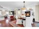 Inviting dining area featuring a cozy fireplace and views to a open concept living space at 8236 S Ireland Way, Aurora, CO 80016