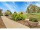 Landscaped backyard with a covered patio and lush greenery, perfect for outdoor enjoyment at 8236 S Ireland Way, Aurora, CO 80016