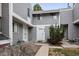 Charming townhome featuring neutral gray siding, white trim, and well-maintained landscaping at 46 S Nome St, Aurora, CO 80012