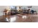 Spacious living room featuring hardwood floors, large windows, and comfortable seating at 46 S Nome St, Aurora, CO 80012