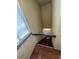 Staircase with wood steps and updated lighting at 46 S Nome St, Aurora, CO 80012