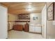 Finished basement with built-in shelving and wet bar at 10106 Grove Loop # A, Westminster, CO 80031