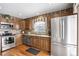 Kitchen with stainless steel appliances and wood cabinets at 10106 Grove Loop # A, Westminster, CO 80031