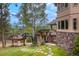 Multi-level decks and stone accents complement the landscaped backyard with views of the surrounding wooded area at 2521 Juniper Ct, Golden, CO 80401