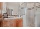 Bright bathroom with a glass-enclosed shower and decorative tile accents at 2521 Juniper Ct, Golden, CO 80401