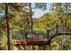 Elevated deck with railings overlooks trees at 2521 Juniper Ct, Golden, CO 80401