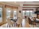 Bright dining area with mountain views, hardwood floors, and access to patio at 2521 Juniper Ct, Golden, CO 80401