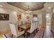 Elegant dining room featuring a decorative ceiling and ample seating for gatherings at 2521 Juniper Ct, Golden, CO 80401