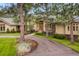 Home with circular driveway, trees, and attractive landscaping at 2521 Juniper Ct, Golden, CO 80401