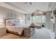 Relaxing main bedroom featuring high ceilings, a fireplace, and serene window views at 2521 Juniper Ct, Golden, CO 80401