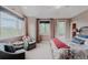 Inviting main bedroom with vaulted ceiling, sitting area, and large windows with mountain views at 2521 Juniper Ct, Golden, CO 80401